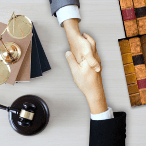 client and insurance provider shake hands after client wins case and insurance company begins making plans for subrogation case
