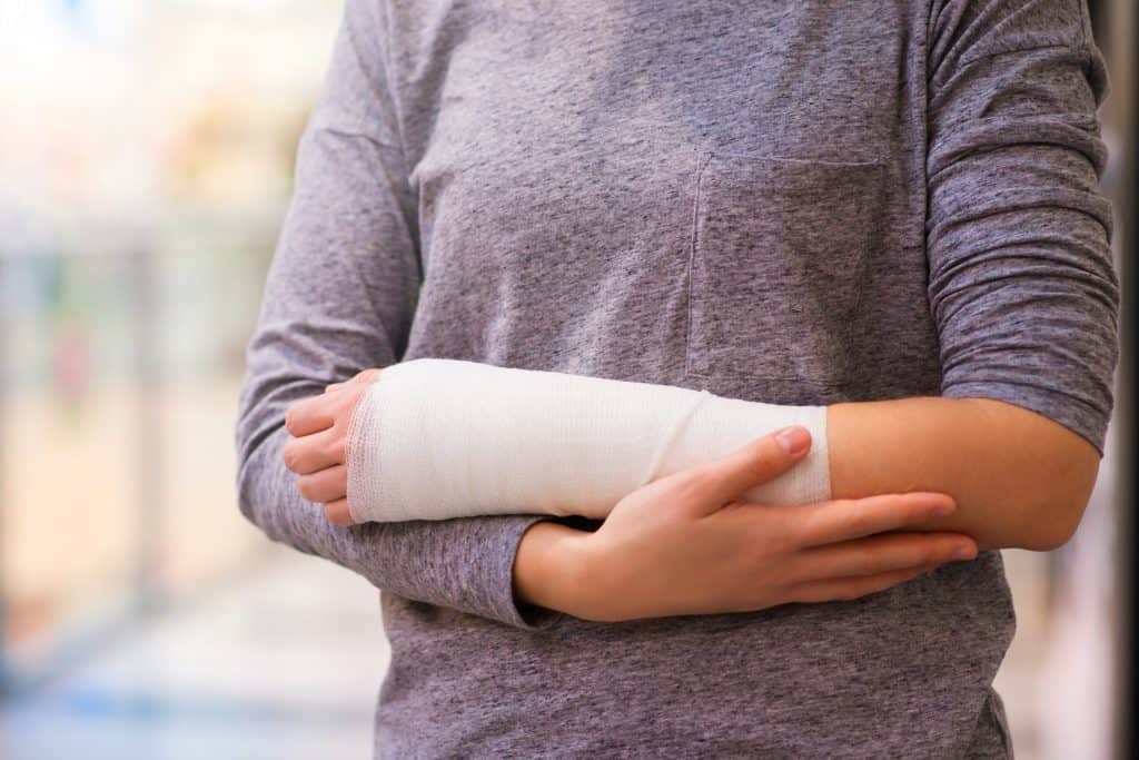 Woman's arm is in a wrap after being injured on the job