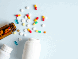 pills spill out of pill bottles being examined in medical malpractice case