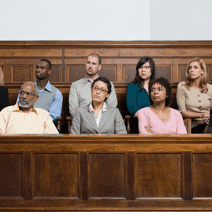jury in wrongful death case looks on during case testimoney
