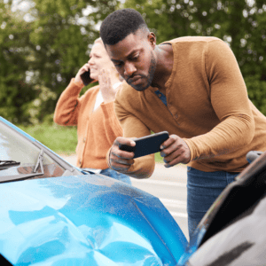man takes photo as evidence to help car accident injury claim to receive car accident compensation