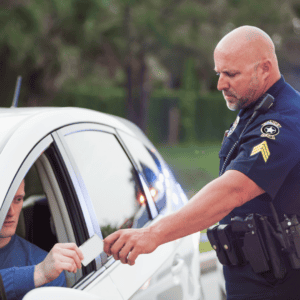 Police officer pulls over new Alabama resident for not following Alabama driving laws. 