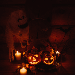A dimly lit porch with wet leaves and uneven steps, highlighting common Halloween injury hazards
