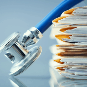 A stack of medical records, symbolizing the importance of documentation in personal injury settlements.